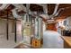 Unfinished basement with utility equipment, offering space for storage, workshop, or potential renovation projects at 115 Flagstop Run, Fayetteville, GA 30215