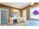 Bathroom featuring a marble countertop, tiled floors, and decorative wall art at 115 Flagstop Run, Fayetteville, GA 30215