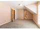 Large, bright bedroom with plush carpeting, attached bathroom, and ample closet space at 115 Flagstop Run, Fayetteville, GA 30215