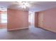 Spacious bedroom with neutral carpeting, natural light, and ample closet space at 115 Flagstop Run, Fayetteville, GA 30215