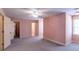 Spacious bedroom with neutral carpeting, natural light, and ample closet space at 115 Flagstop Run, Fayetteville, GA 30215