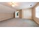 Open bonus room with closet space and access to the rest of the house at 115 Flagstop Run, Fayetteville, GA 30215