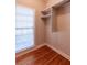 Walk-in closet with hardwood floors and closet rod with storage at 115 Flagstop Run, Fayetteville, GA 30215