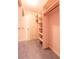 Walk-in closet with built-in shelving and ample storage space at 115 Flagstop Run, Fayetteville, GA 30215
