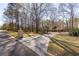 Long driveway leading to home with mature trees at 115 Flagstop Run, Fayetteville, GA 30215