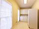 Functional laundry room features tile floors, plenty of light, and a full sized washer and dryer at 115 Flagstop Run, Fayetteville, GA 30215