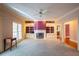 Bright living room with built-in shelves, a fireplace, ceiling fan, and ample space at 115 Flagstop Run, Fayetteville, GA 30215
