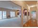 Spacious living room featuring built-in shelves, a fireplace, ceiling fan, and lots of natural light at 115 Flagstop Run, Fayetteville, GA 30215