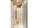 Bathroom featuring an open shower with glass doors and gold hardware at 115 Flagstop Run, Fayetteville, GA 30215