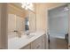 Bathroom with a big mirror over vanity, door to hall, and view to bedroom at 2403 Wistful Way, Marietta, GA 30066