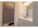 Bathroom featuring a vanity, mirror, and tiled shower with curtain at 2403 Wistful Way, Marietta, GA 30066
