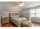 Charming bedroom featuring high ceilings, wood floors, and a large window at 2403 Wistful Way, Marietta, GA 30066