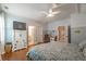 Bedroom featuring high ceilings, wood floors, a TV, and several entrances at 2403 Wistful Way, Marietta, GA 30066