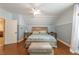 Bedroom featuring high ceilings, wood floors, and a large window at 2403 Wistful Way, Marietta, GA 30066