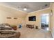 Bonus room with a big tv, comfortable couch, and a small door at 2403 Wistful Way, Marietta, GA 30066