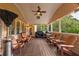 Covered patio with string lights, ceiling fan, grill, and outdoor furniture at 2403 Wistful Way, Marietta, GA 30066