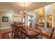 Spacious dining room with hardwood floors, view of the staircase, and access to the living room at 2403 Wistful Way, Marietta, GA 30066