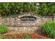 Stone monument sign for Brookview Manor with manicured flowerbeds and mature trees, marking the community entrance at 2403 Wistful Way, Marietta, GA 30066