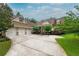 Charming home with a three-car garage, landscaped front yard, and a welcoming front porch under a cloudy blue sky at 2403 Wistful Way, Marietta, GA 30066