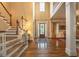 Grand foyer with hardwood floors, staircase, and a view into the dining room, creating an inviting entrance at 2403 Wistful Way, Marietta, GA 30066