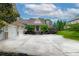 Charming home with a three-car garage, manicured landscaping, and an inviting front entrance at 2403 Wistful Way, Marietta, GA 30066