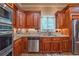 Gourmet kitchen with stainless steel appliances, custom cabinetry, and granite counters is well-appointed at 2403 Wistful Way, Marietta, GA 30066