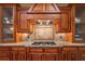 Custom cabinetry and a granite-topped island are highlighted in this close up image of the kitchen at 2403 Wistful Way, Marietta, GA 30066