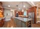 Gourmet kitchen with granite countertops, stainless steel appliances, and a central island for meal preparation at 2403 Wistful Way, Marietta, GA 30066