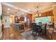 Well-lit kitchen features an island, stainless steel appliances, and a breakfast nook with hardwood floors at 2403 Wistful Way, Marietta, GA 30066