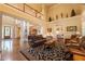 Spacious living room connecting to the foyer, dining area, and other living spaces with hardwood floors at 2403 Wistful Way, Marietta, GA 30066