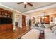 Spacious living area with hardwood floors, built-in shelving, and seamlessly connecting to the kitchen at 2403 Wistful Way, Marietta, GA 30066