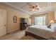 Main bedroom features neutral decor, a ceiling fan, and an ensuite bathroom at 2403 Wistful Way, Marietta, GA 30066