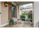 Charming porch featuring stone flooring, rocking chairs, and beautiful views of lush greenery at 2403 Wistful Way, Marietta, GA 30066