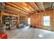 Expansive unfinished basement with exposed framing, concrete floors, and windows for natural light and easy customization at 2403 Wistful Way, Marietta, GA 30066