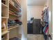 Walk-in closet with custom shelving and storage, and carpet flooring at 2403 Wistful Way, Marietta, GA 30066