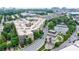 A picturesque apartment complex with manicured lawns, a pond, and scenic views of the surrounding neighborhood and city at 390 17Th Nw St # 2053, Atlanta, GA 30363