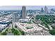Stunning aerial view of a modern apartment complex surrounded by lush green trees in a bustling urban environment at 390 17Th Nw St # 2053, Atlanta, GA 30363