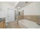Bathroom featuring a bathtub and a separate glass door shower at 390 17Th Nw St # 2053, Atlanta, GA 30363