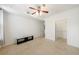 This bedroom offers neutral carpet, a ceiling fan, and a walk-in closet with organizers at 390 17Th Nw St # 2053, Atlanta, GA 30363