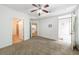Spacious bedroom with hardwood floors and a view into a bathroom and kitchen at 390 17Th Nw St # 2053, Atlanta, GA 30363