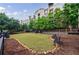 Beautifully manicured dog park with synthetic grass and seating. Lots of space for dogs to roam at 390 17Th Nw St # 2053, Atlanta, GA 30363
