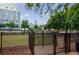 Enclosed dog park area for pets to play, with a cityscape in the background at 390 17Th Nw St # 2053, Atlanta, GA 30363