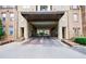 Stone building entryway and gate for parking access at 390 17Th Nw St # 2053, Atlanta, GA 30363