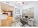 Bright home office featuring a workstation, and a unique glass block window for natural light at 390 17Th Nw St # 2053, Atlanta, GA 30363