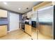 A kitchen with stainless steel appliances, granite countertops, wooden cabinets, and plenty of space for cooking and entertaining at 390 17Th Nw St # 2053, Atlanta, GA 30363