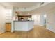 Modern kitchen featuring stainless appliances, breakfast bar and display shelves at 390 17Th Nw St # 2053, Atlanta, GA 30363