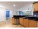 An open-concept kitchen with sleek countertops, stainless steel appliances, and seamless flow into the adjacent living room at 390 17Th Nw St # 2053, Atlanta, GA 30363