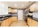 Modern kitchen with granite countertops, stainless steel appliances, and light wood cabinets that bring warmth to the living space at 390 17Th Nw St # 2053, Atlanta, GA 30363