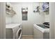 Well-lit laundry room features a side-by-side washer and dryer at 390 17Th Nw St # 2053, Atlanta, GA 30363