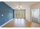 Spacious living room with an accent wall and balcony access at 390 17Th Nw St # 2053, Atlanta, GA 30363